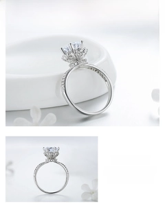 Detailed view of silver crown ring featuring full pavé diamonds and a large zircon