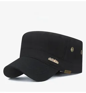 Detail of black cotton cadet cap showing metal outdoor tag and breathable side vents
