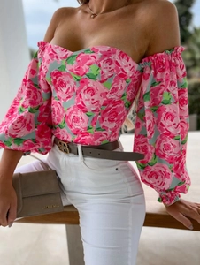 Close-up of pink rose floral off-shoulder top with puff sleeves and sweetheart neckline