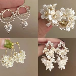 French vintage pearl floral tassel earrings with gold finish and elegant heart charms