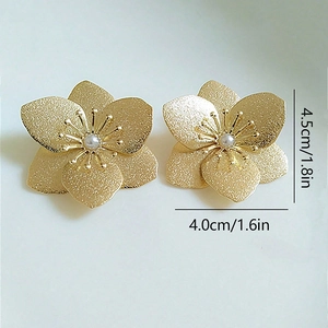 Detailed size view of gold flower earrings with matte petals and centered pearls