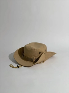 Detail view of khaki sun hat with wide brim, side air vents and adjustable chin strap