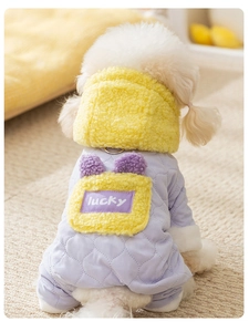 Detail of warm quilted dog hoodie with yellow fleece pocket and lucky print detail
