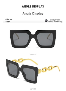 Detalle de gafas de sol cuadradas de gran tamaño con patillas de cadena dorada de moda