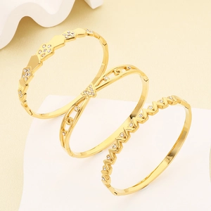 Detail of three-piece 18K gold-plated irregular geometric bangles with zircon inlay