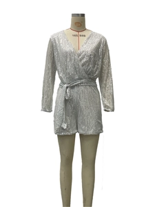 Detailed view of silver sequin romper with a deep V-neck and sparkling waist tie belt