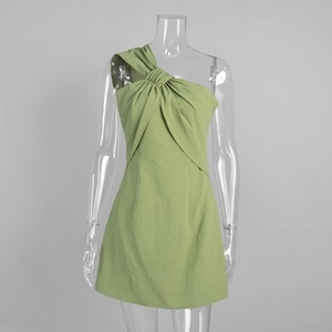 Close-up of avocado green one-shoulder mini dress with twist knot detail and texture