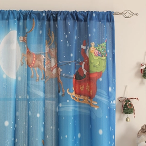 Detail of blue Christmas blackout curtain with Santa's sleigh and reindeer on starry night
