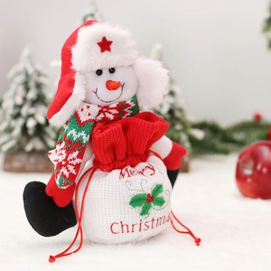 Cute Christmas plush snowman doll holding a red and white drawstring apple gift bag