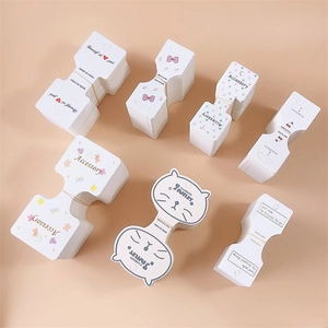 Assorted jewelry display cards for hair clips in various floral and cat patterns