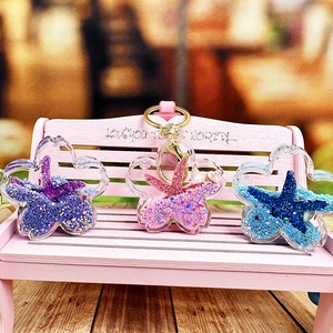 Creative cherry blossom starfish liquid keychains in purple, pink, and blue colors
