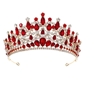 Detailed view of luxury gold bridal tiara with red teardrop gems and sparkling crystals