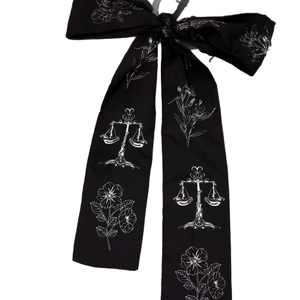Elegant black fabric bow hair stick with white Libra and floral patterns for women