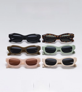 Flat lay of retro cat eye sunglasses in six assorted colors with thick geometric frames