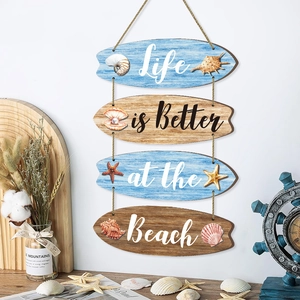 Coastal wooden surfboard wall hanging with starfish and nautical sea shell designs