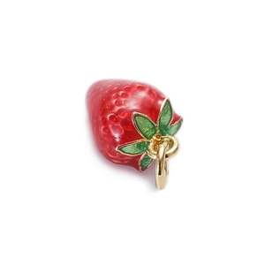 Detailed close-up of a red strawberry enamel pendant with green leaves and gold ring