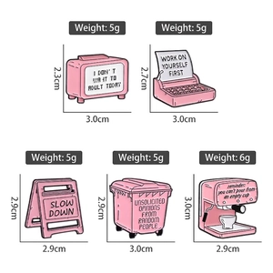 Pink cartoon enamel pins collection featuring coffee maker and typewriter for bags