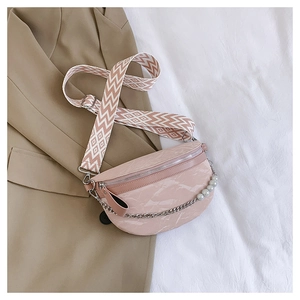 Detail of pink marble textured waist bag with pearl chain and geometric woven strap