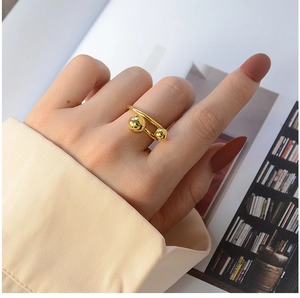 Detail view of 18K gold plated titanium steel double ball U-shaped open ring for women