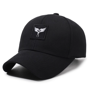 Classic black embroidered baseball cap with abstract wing badge and curved brim