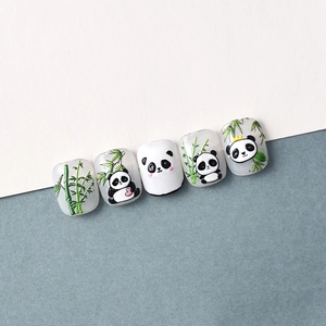 Detail of 3D embossed panda and bamboo nail art decals with matte frosted texture