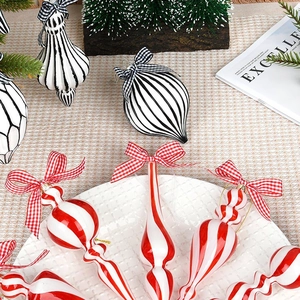 Modern black and white striped glass Christmas ornaments with elegant ribbon bows