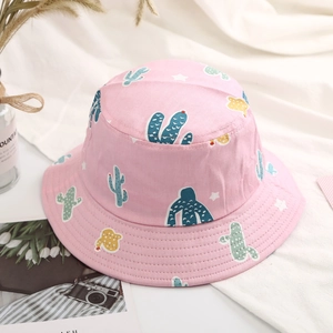 Detail of pink cotton sun hat featuring cute cactus pattern and breathable fabric
