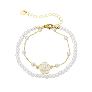 Elegant two-layer gold plated bracelet with white camellia pendant and pearls