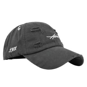 Detail view of distressed dark grey baseball cap with 19XX and LA white embroidery