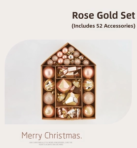Close-up of 52-piece rose gold Christmas ornament set in a house-shaped gift box