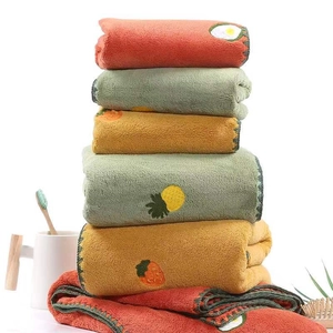 Absorbent coral fleece towel set with embroidered fruit patterns in orange green and yellow