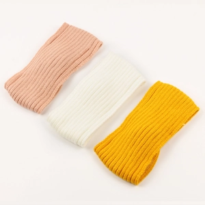 Three-pack ribbed knit headbands in pink white and yellow colors for winter warmth