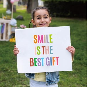 Colorful 2-inch letter stickers used to create 'SMILE IS THE BEST GIFT' text on card