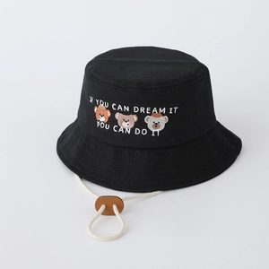 Detail view of cotton bucket hat with cartoon bear embroidery and adjustable chin strap