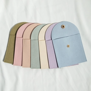 Microfiber envelope jewelry pouches in seven pastel colors with metal snap buttons
