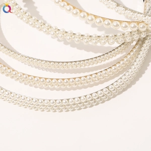 Detail shot of various pearl headbands featuring different sizes and beaded arrangements