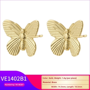Detail view of 18K gold plated butterfly stud earrings showing dimensions and brass texture