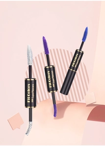 Close-up of white, purple, and blue dual-ended waterproof mascara tubes with gold accents