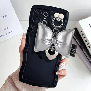 Silver puffed bow and heart charm on black wavy edge phone case for Samsung S series
