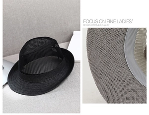 Close-up of black breathable mesh straw fedora with interior grey sweatband detail