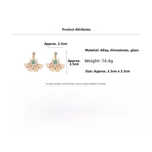 Detailed view of vintage crystal fan earrings with silver needles and gold base