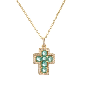 Gold necklace with cross pendant featuring green square stones and clear crystals