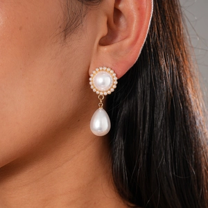 Elegant gold drop earrings with round and teardrop pearls and pavé crystal accents
