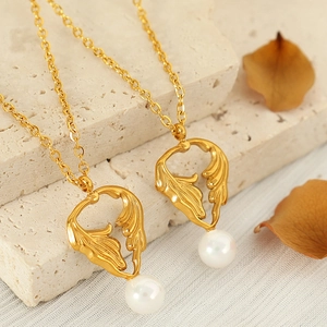 Golden angel wing necklace with pearl pendant on a thin O-chain for women