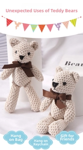 Detailed view of beige knitted bear pendants with brown bows for bag or key decoration