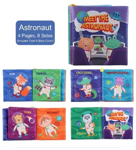 Detail view of astronaut cloth book featuring multi-colored 3D animal tails and English labels
