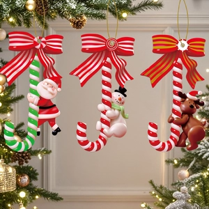 Detailed view of Santa, Snowman and Reindeer climbing candy canes on Christmas tree