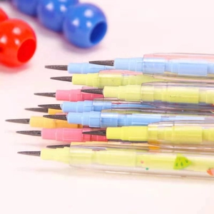 Close-up of colorful stackable bullet pencils in pastel blue pink and yellow colors