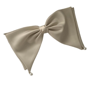 Elegant champagne silk bow hair clip with pearl drops on a clean white background