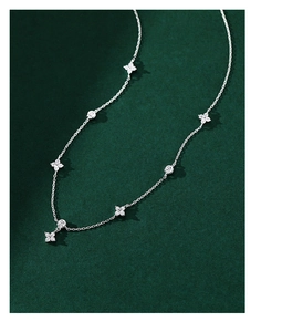 Detailed view of S925 sterling silver four-leaf clover necklace with sparkling zircons